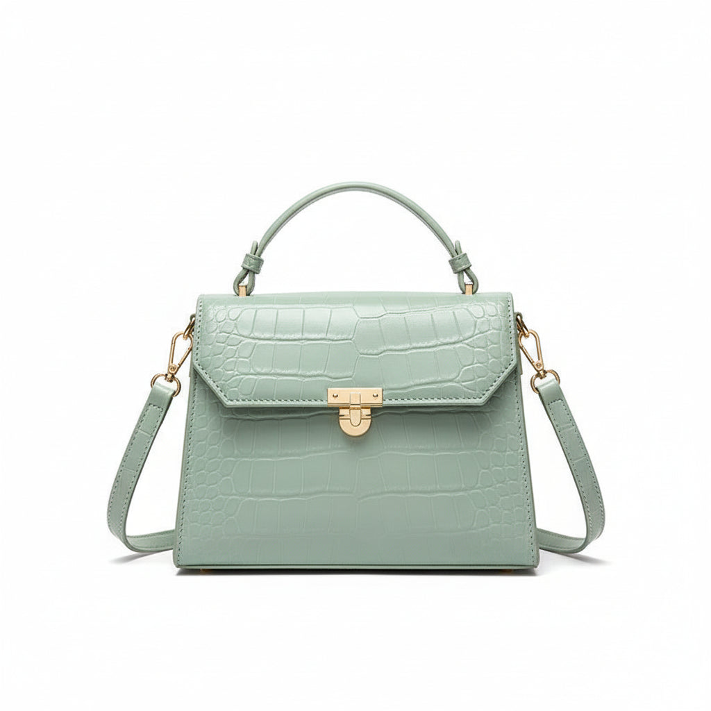 Person holding a light blue handbag in an indoor setting