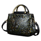 Decorative handbag with floral patterns on a dark background