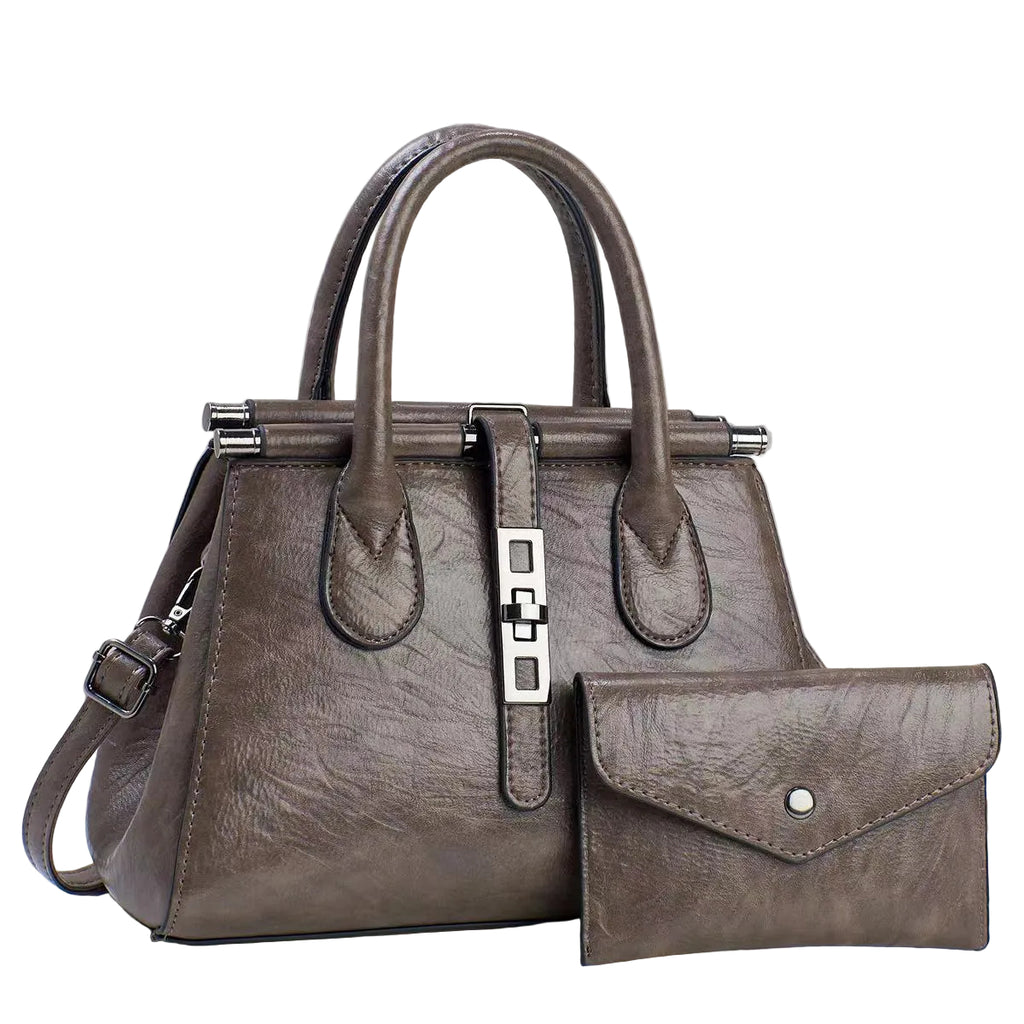 Brown leather handbag with matching wallet on a light gray background