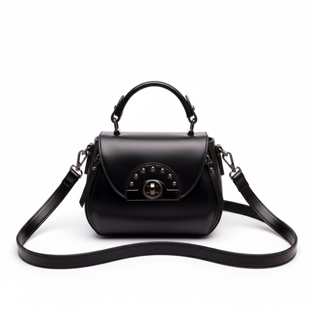 Black handbag with a strap on a wooden surface with 'ORIGINALS' branding.