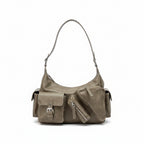 Beige handbag on a laptop on a metal cart with a neutral background