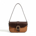 Brown and beige handbag with a gold buckle on a beige background