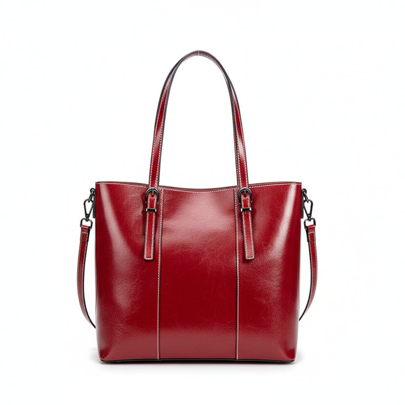 Red leather handbag on a light gray background