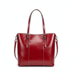 Red leather handbag on a light gray background
