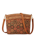 Cork handbag with hexagonal pattern and brown strap on a beige background