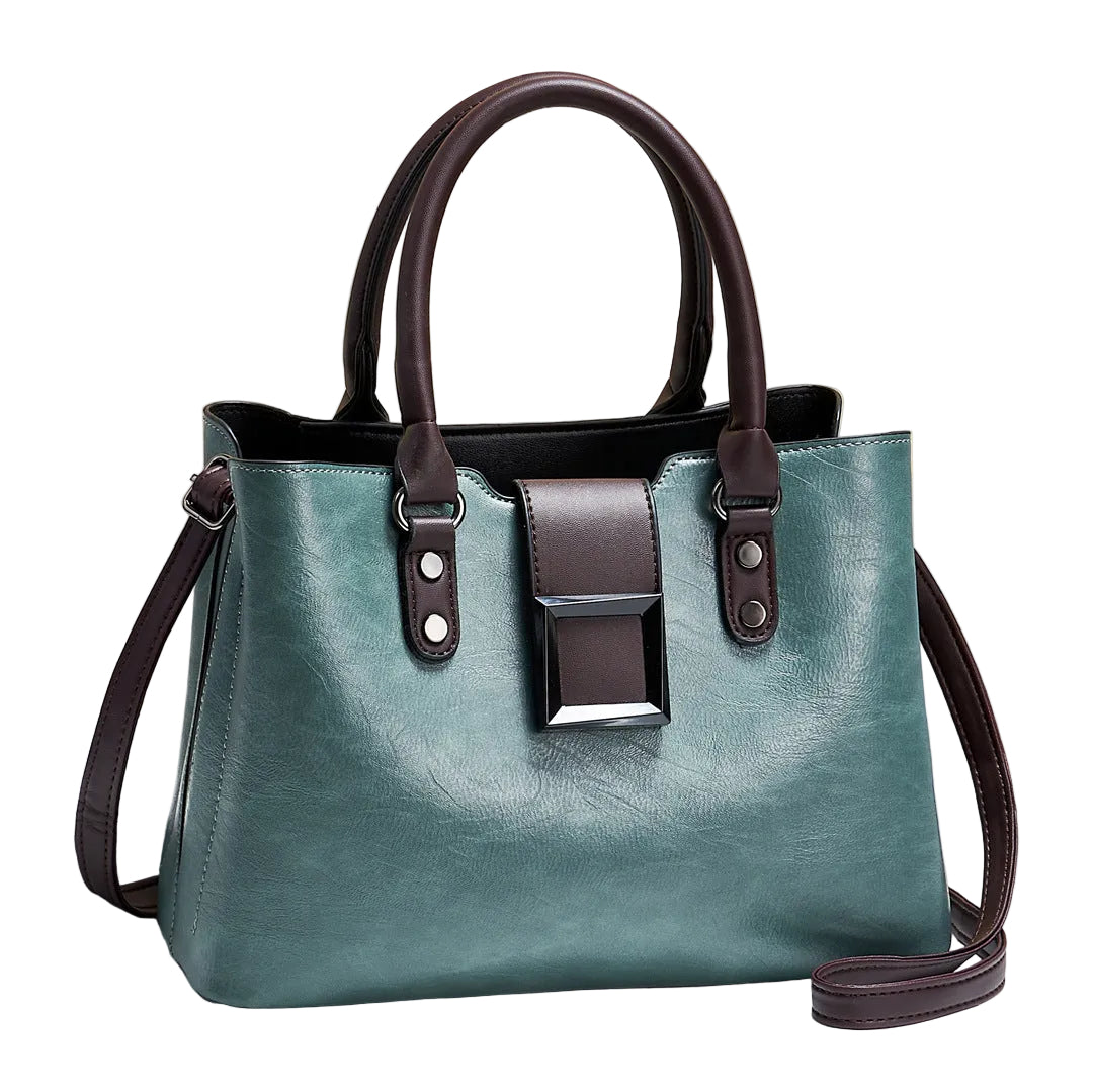 Teal handbag with brown straps on a light background
