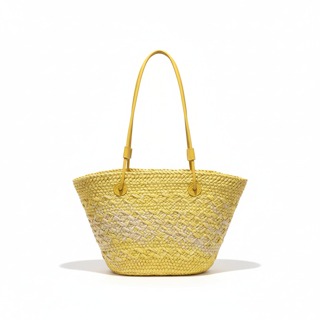 Yellow woven handbag hanging on a rack with clothing in the background