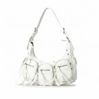 White handbag with fringe details on a light gray background