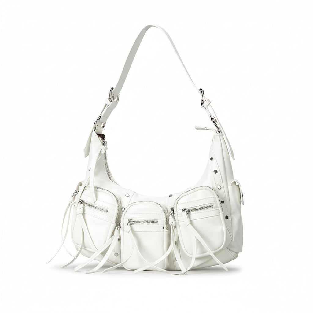 White handbag with fringe details on a light gray background