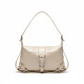 Beige handbag on a surface with a minimalistic background