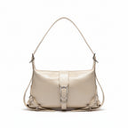 Beige handbag on a surface with a minimalistic background