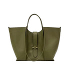 Green leather handbag with a gold buckle on a white background