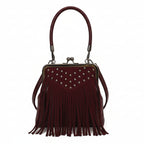 Wine red handbag with fringe details on a white background