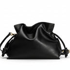 Black drawstring bag on a light gray background