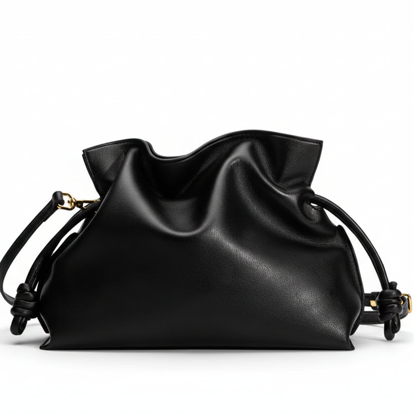 Black drawstring bag on a light gray background