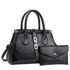 Black handbag with matching wallet on a light gray background