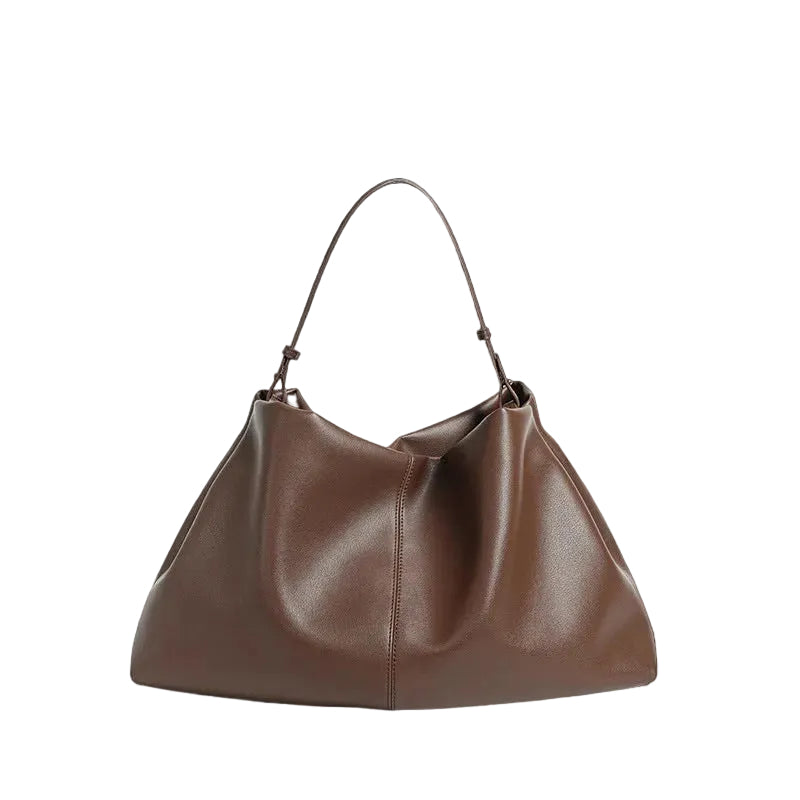 Brown leather handbag on a white background