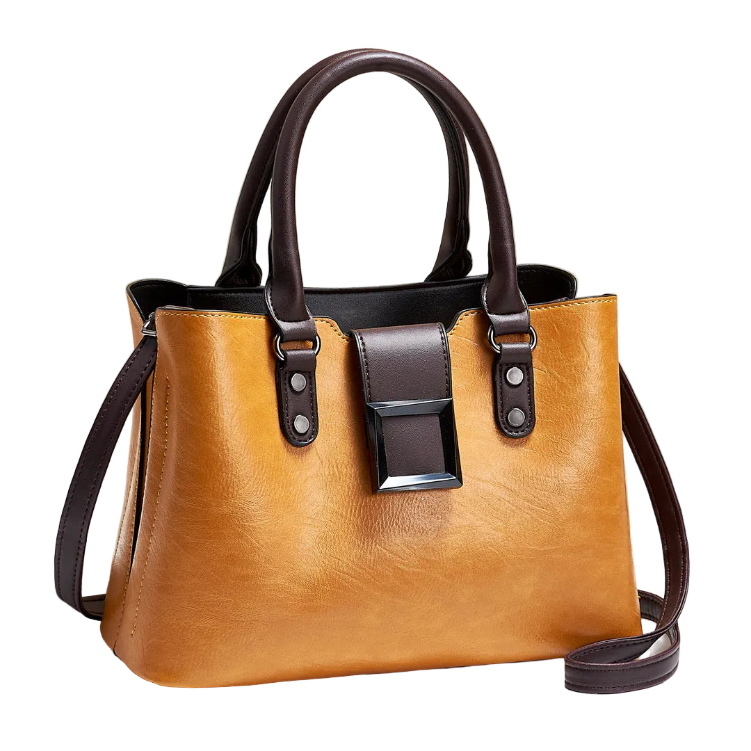 Brown handbag with black accents on a light beige background